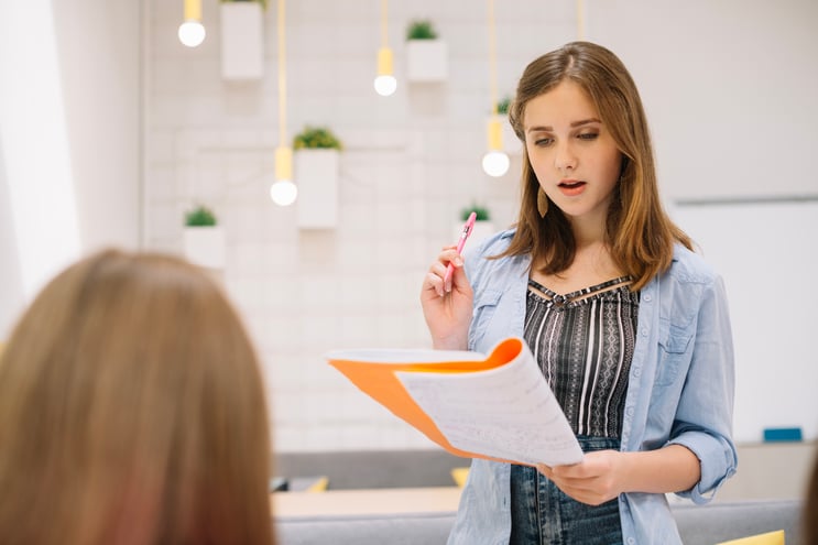 woman-making-report-classroom